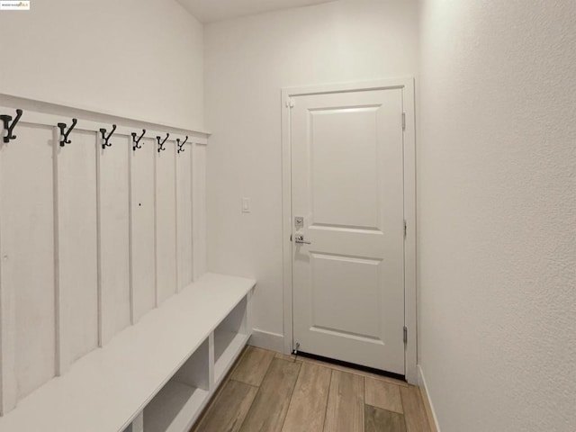 mudroom with light hardwood / wood-style flooring