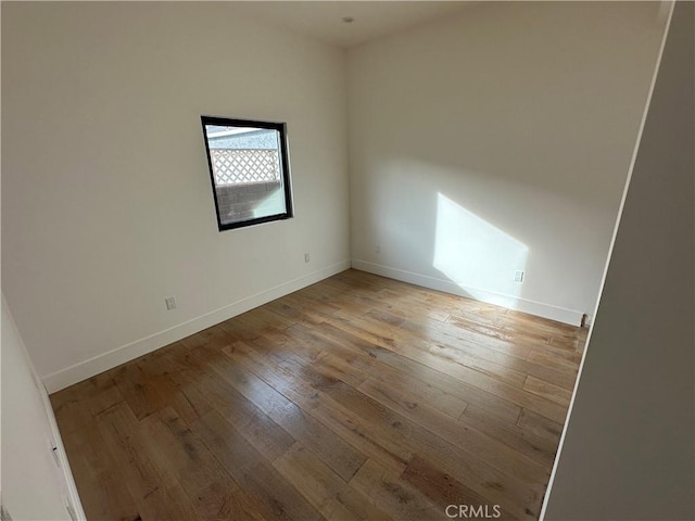 spare room featuring light wood-type flooring