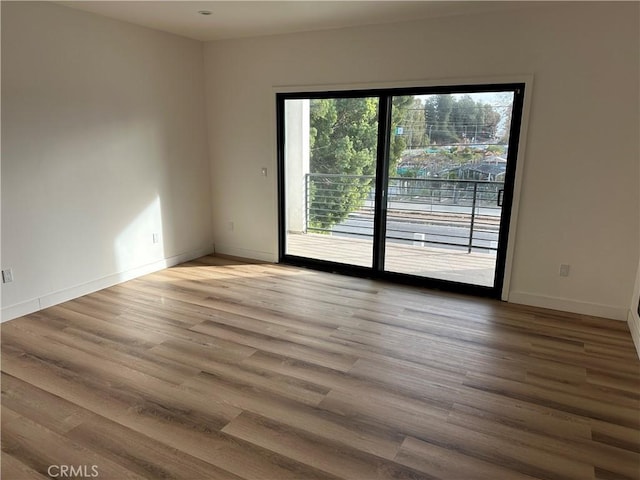 unfurnished room featuring light wood-type flooring