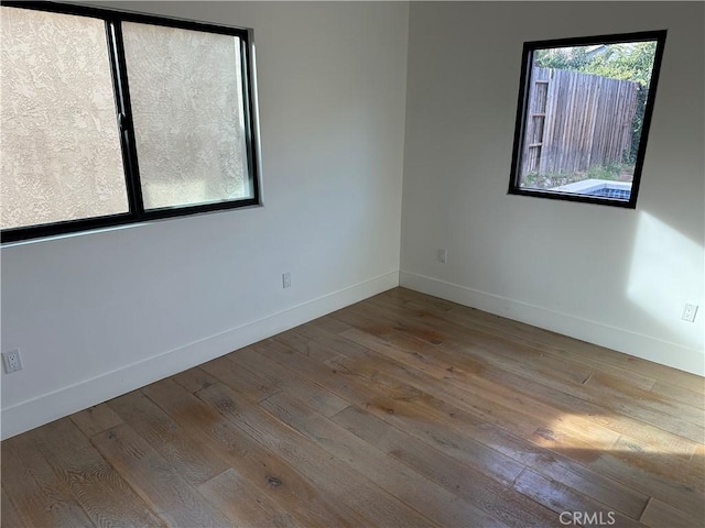 spare room with light wood-type flooring