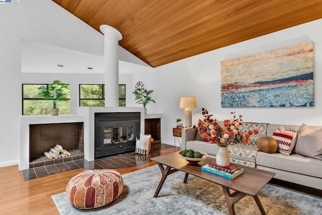 living room with lofted ceiling, wood ceiling, and wood-type flooring