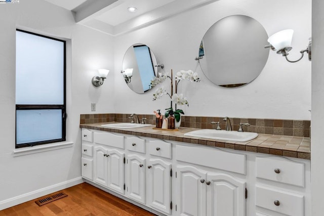 bathroom featuring wood-type flooring and vanity