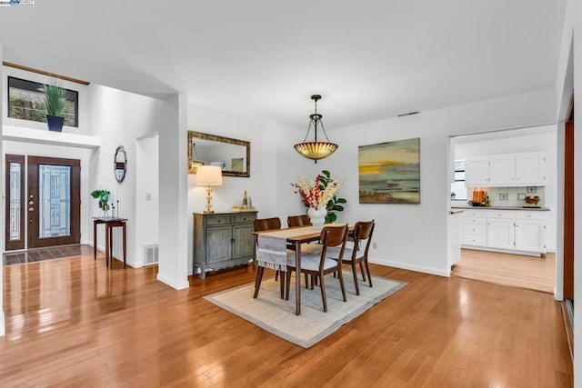 dining room with light hardwood / wood-style flooring