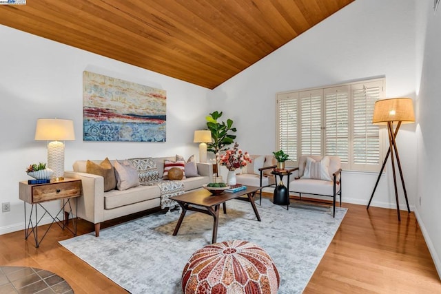 living room featuring lofted ceiling, hardwood / wood-style flooring, and wooden ceiling