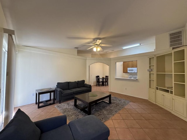 living room with light tile patterned flooring and ceiling fan