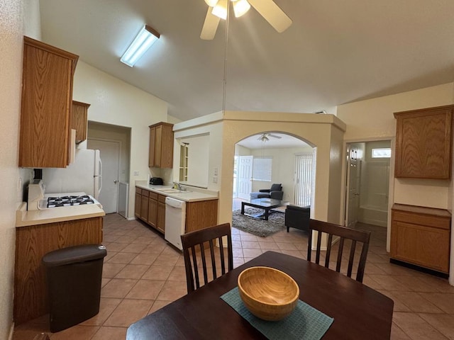 kitchen featuring sink, white appliances, ceiling fan, and light tile patterned flooring