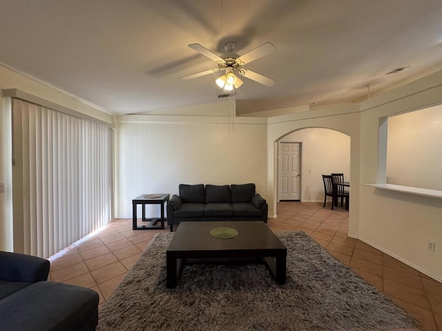 tiled living room featuring vaulted ceiling and ceiling fan