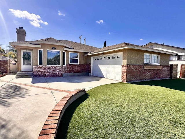 view of front of property featuring a garage and a front lawn