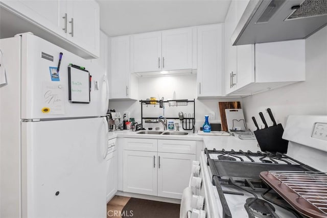 kitchen featuring wall chimney exhaust hood, sink, white cabinetry, hardwood / wood-style flooring, and white appliances