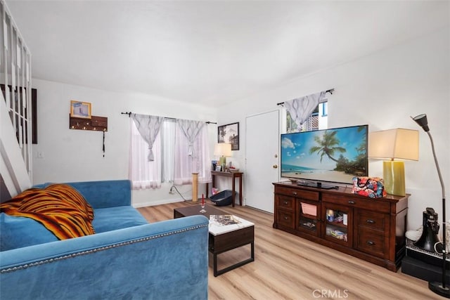 living room with light hardwood / wood-style flooring