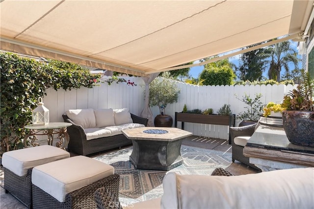 view of patio / terrace featuring an outdoor living space with a fire pit