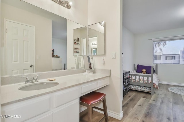 bathroom with wood-type flooring and vanity