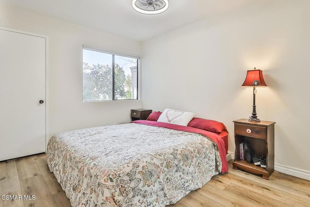 bedroom with hardwood / wood-style flooring