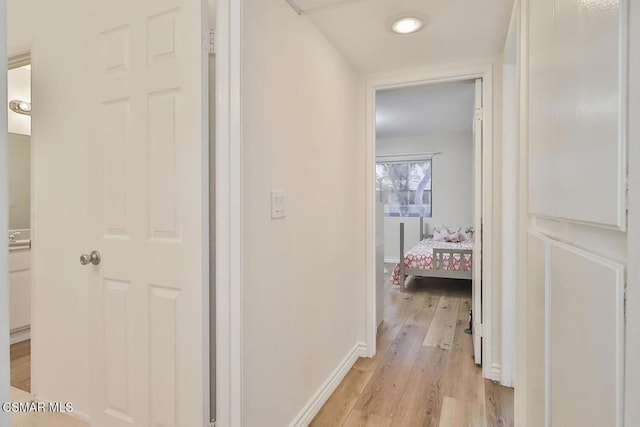 hallway featuring light hardwood / wood-style flooring