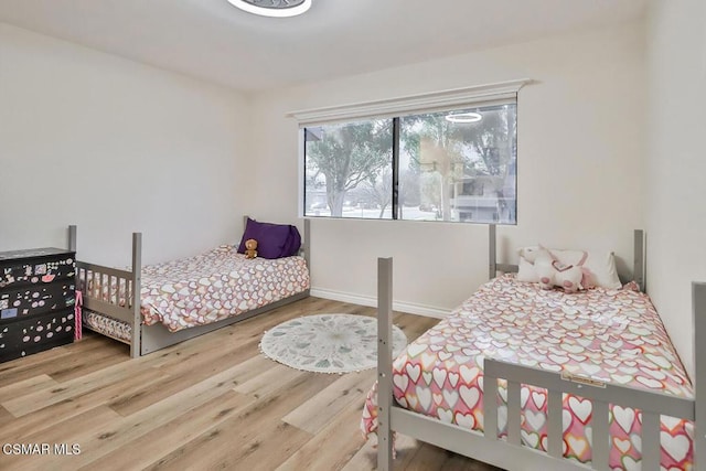 bedroom with hardwood / wood-style floors