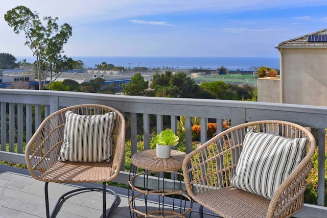 balcony featuring a water view