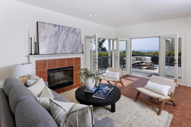 tiled living room featuring a tiled fireplace