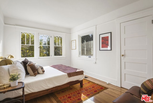 bedroom featuring light wood-type flooring