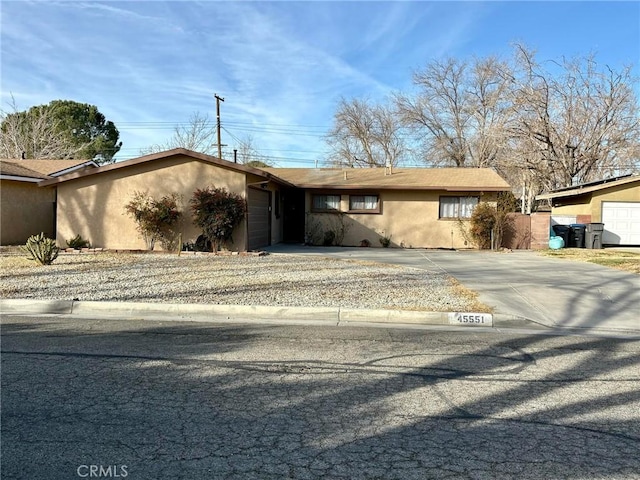 single story home with a garage