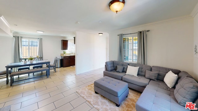 living room with crown molding and light tile patterned floors