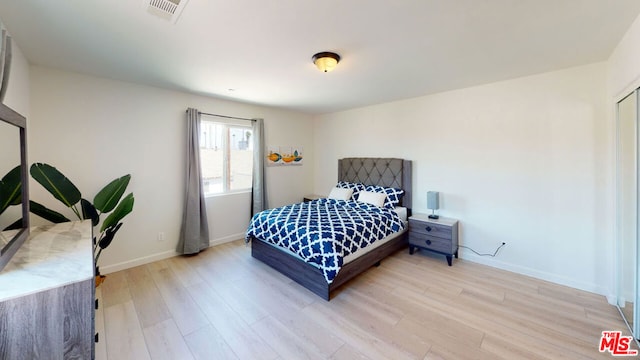 bedroom with light wood-type flooring