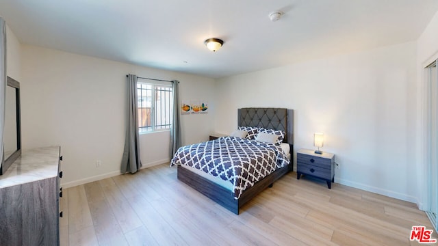 bedroom with light hardwood / wood-style floors