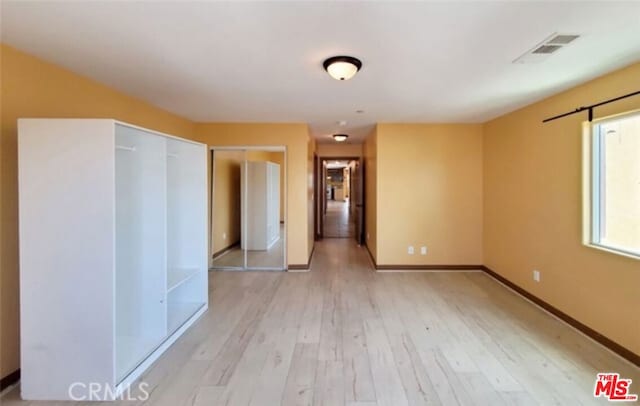 empty room with light wood-type flooring