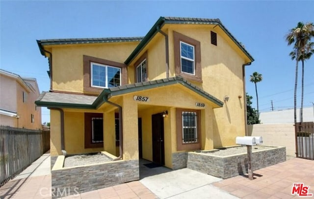 back of house with a patio area