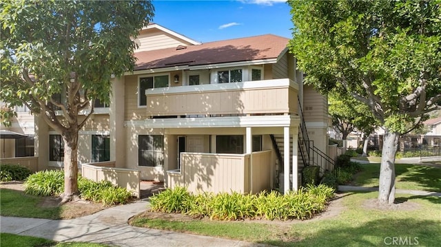 view of front of property with a balcony