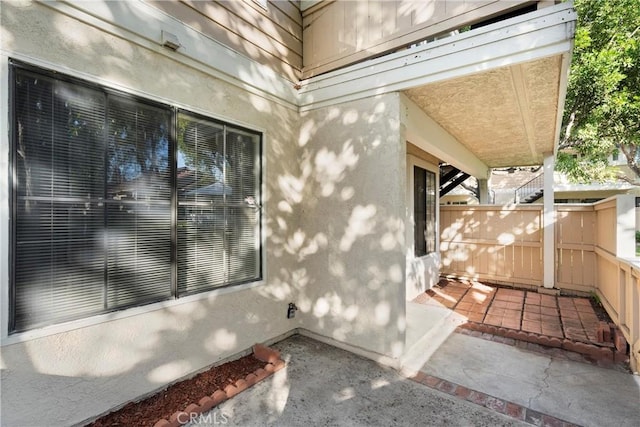 doorway to property with a patio