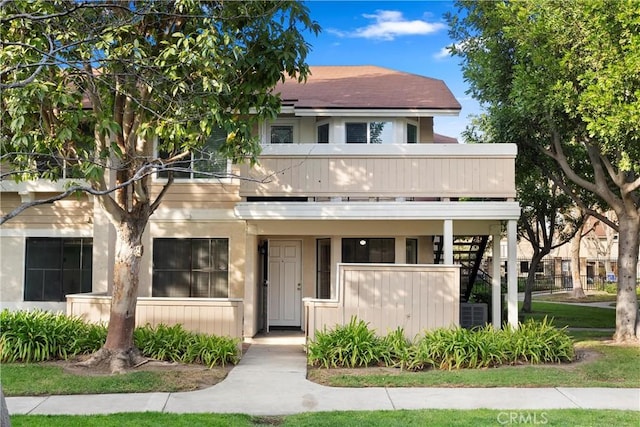 view of front of home featuring a balcony