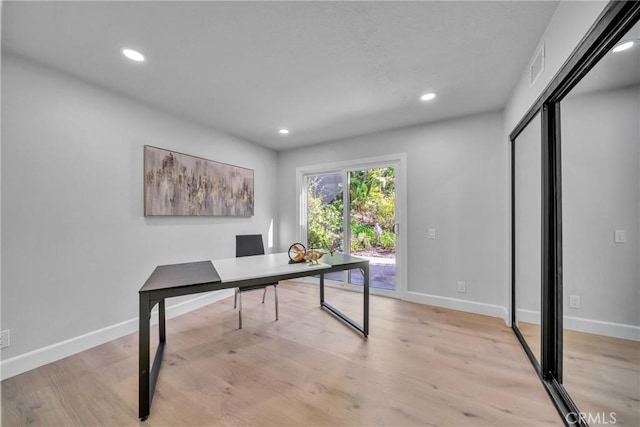 office area with light hardwood / wood-style flooring