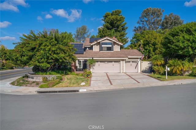 view of front of home featuring solar panels