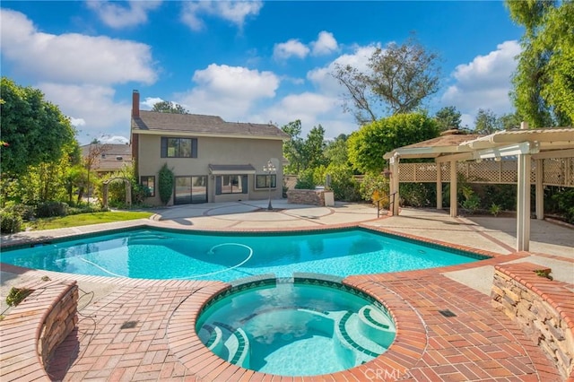 view of swimming pool with a pergola, a patio, and an in ground hot tub