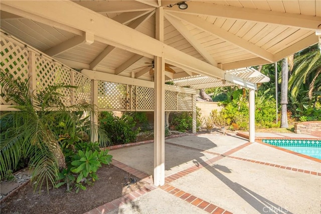 view of patio with ceiling fan and a pergola