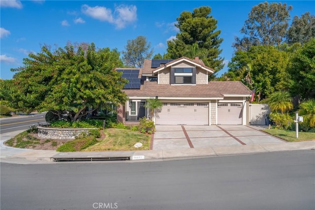 view of front of property with solar panels