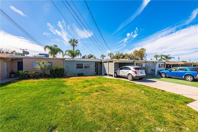 ranch-style home with stucco siding, a front yard, and driveway