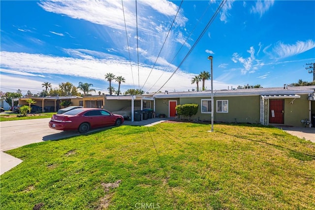 single story home with a front lawn, driveway, and stucco siding