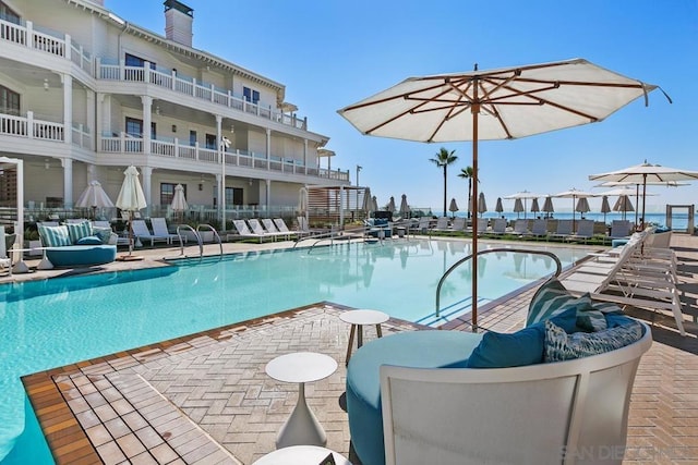 view of swimming pool featuring a patio area