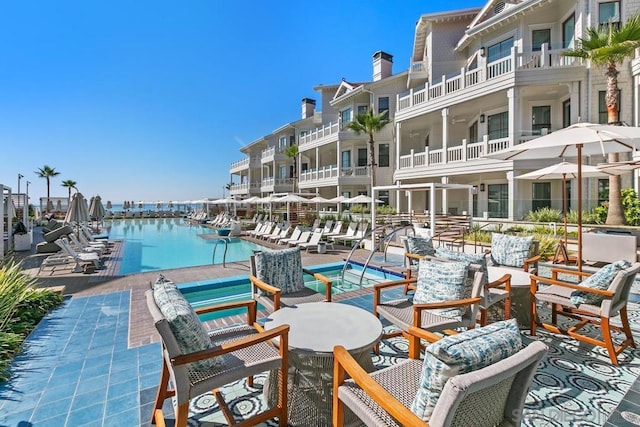 view of pool with a water view