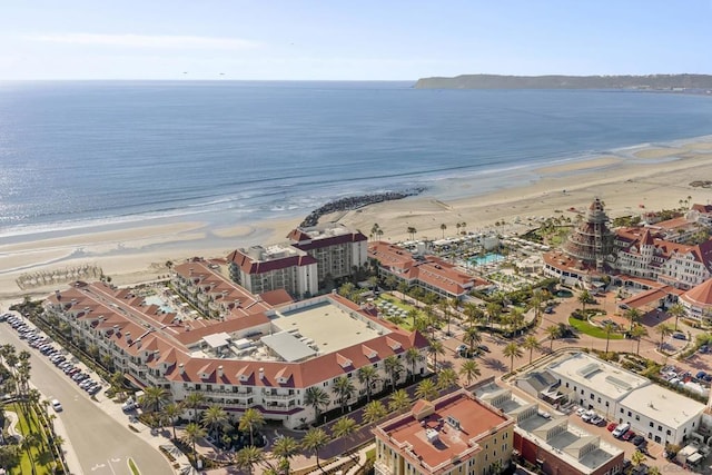 birds eye view of property featuring a water view and a view of the beach