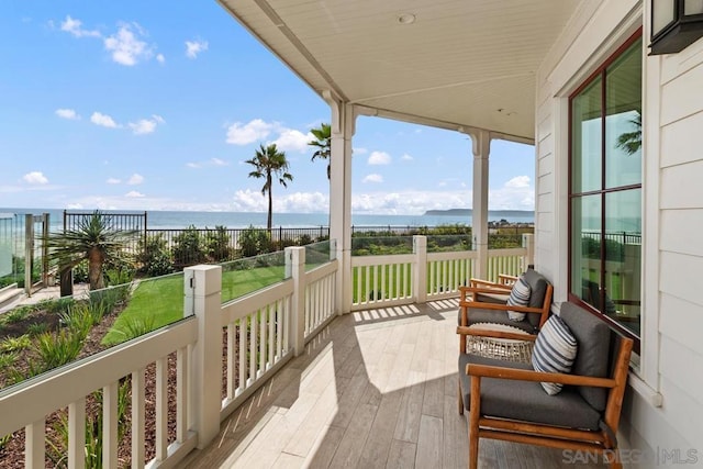 balcony featuring a water view