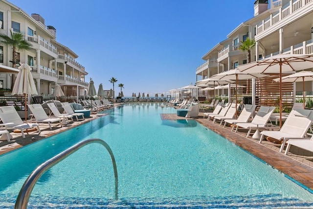 view of swimming pool featuring a water view