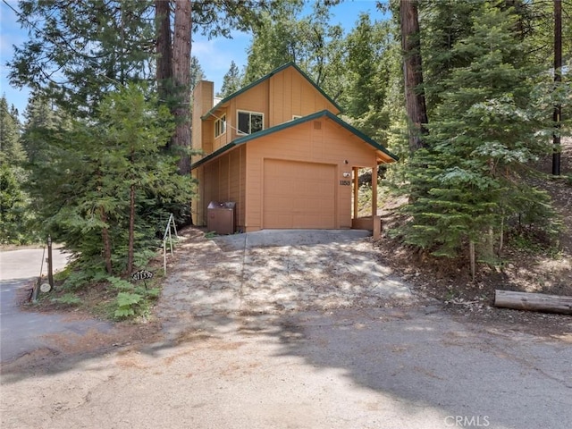 1153 Silvertip Ln, Fish Camp, CA 93623 - view of front of house featuring a garage