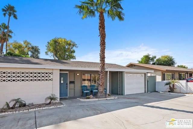 ranch-style home featuring a garage