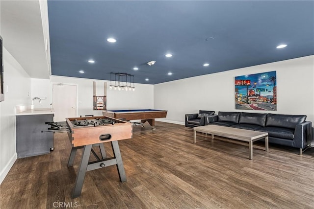 game room with dark hardwood / wood-style flooring, sink, and pool table