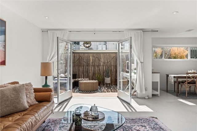 living room with concrete flooring