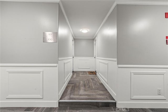 hall with ornamental molding and dark parquet floors