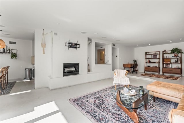 living room featuring concrete floors