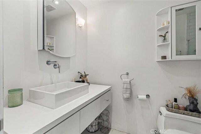 bathroom with vanity and toilet